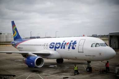 FILE PHOTO: A Spirit Airlines A320-200 airplane sits at a gate at the O’Hare Airport in Chicago, Illinois