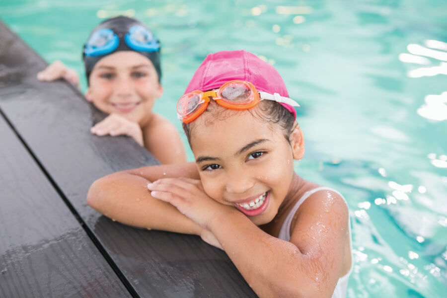 Cute swimming class in the pool