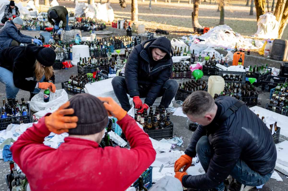Local residents prepare Molotov cocktails to defend their city, in Zhytomyr
