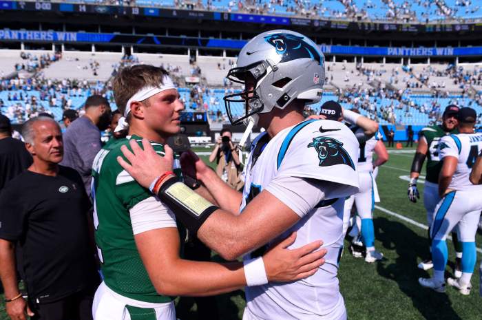 Jets quarterback Zach Wilson with former Jets passer Sam Darnold.