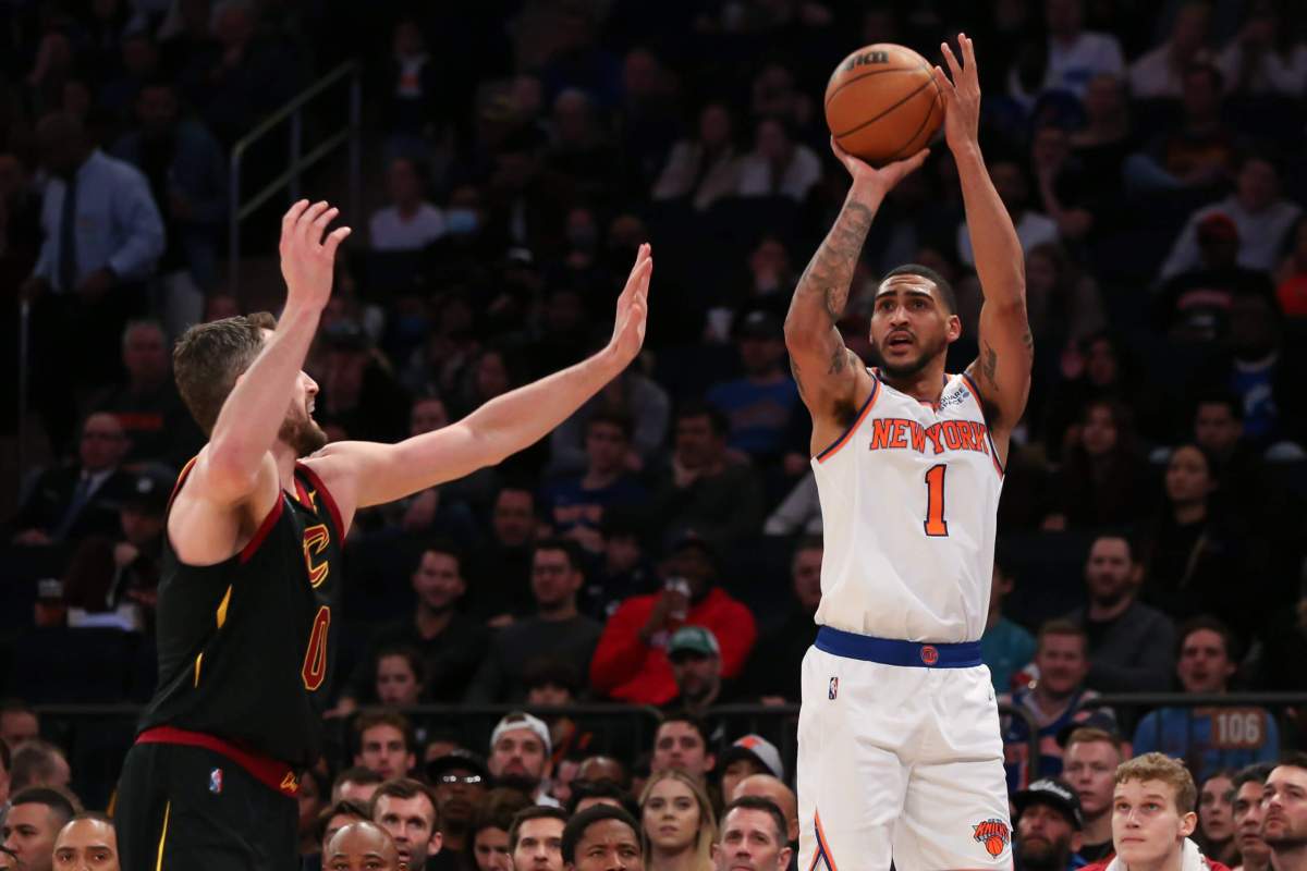 Knicks forward Obi Toppin shoots the ball against Cleveland Cavaliers forward Kevin Love.