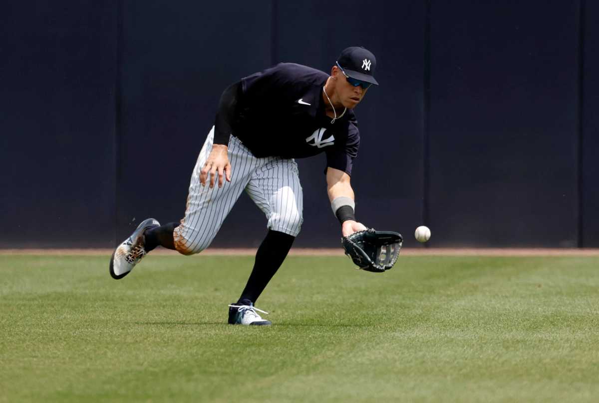 Yankees right fielder Aaron Judge fields a ball during the fourth inning against the Philadelphia Phillies during spring training.
