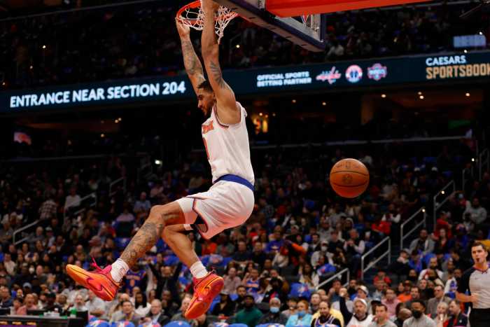 Knicks forward Obi Toppin dunks the ball against the Washington Wizards.