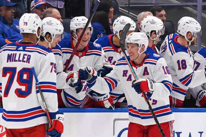 Rangers center Ryan Strome celebrates a goal with the New York Rangers bench.