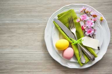 Easter table setting with spring flowers and cutlery