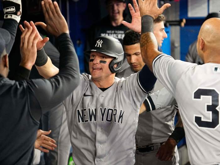 Yankees third baseman Josh Donaldson gets congratulated after scoring against the Toronto Blue Jays.