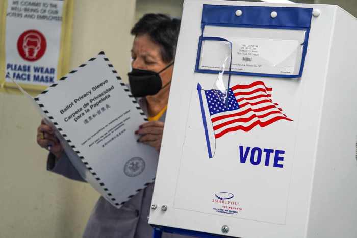 A primary voter reviewing ballot