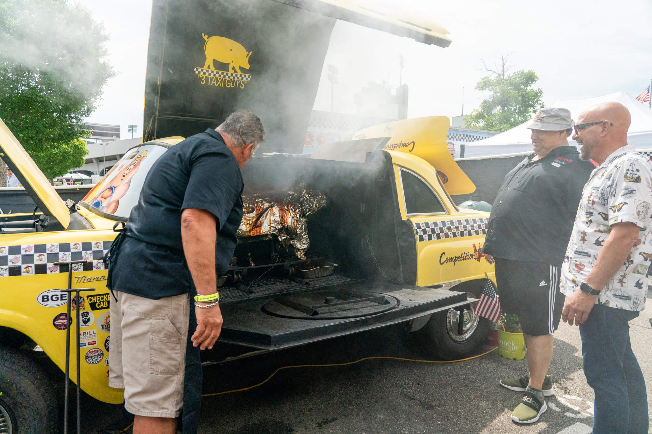 Michael Symon follows barbeque competition circuit in new Food Network show 'BBQ USA' 3 Host Michael Symon Interacts with 3 Taxi Guys at the Memphis in May in Memphis Tennessee