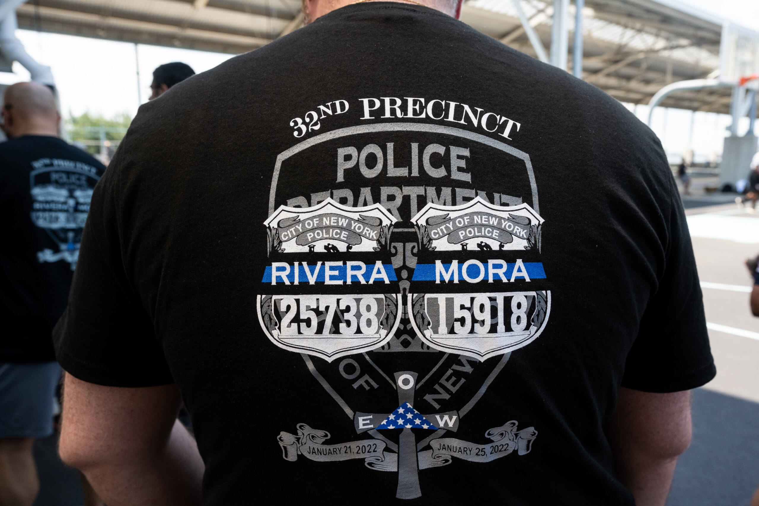 NYDO and NYPD Blue Chips host inaugural 'Basketball Classic' in honor of fallen comrades Rivera and Mora 8 An NYPD officer wears a shirt in memory of Detectives Jason Rivera