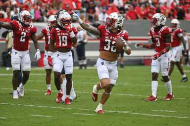N.C. State linebacker Drake Thomas celebrates a turnover