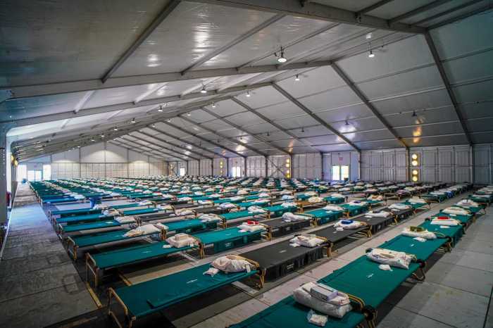 Lines of cots at the migrant tent city set up on Randall's Island