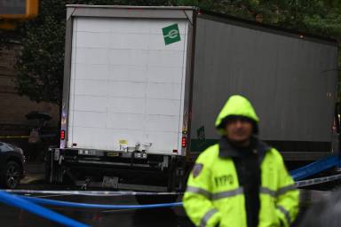 A police officer stands at a crash scene in Williamsburg