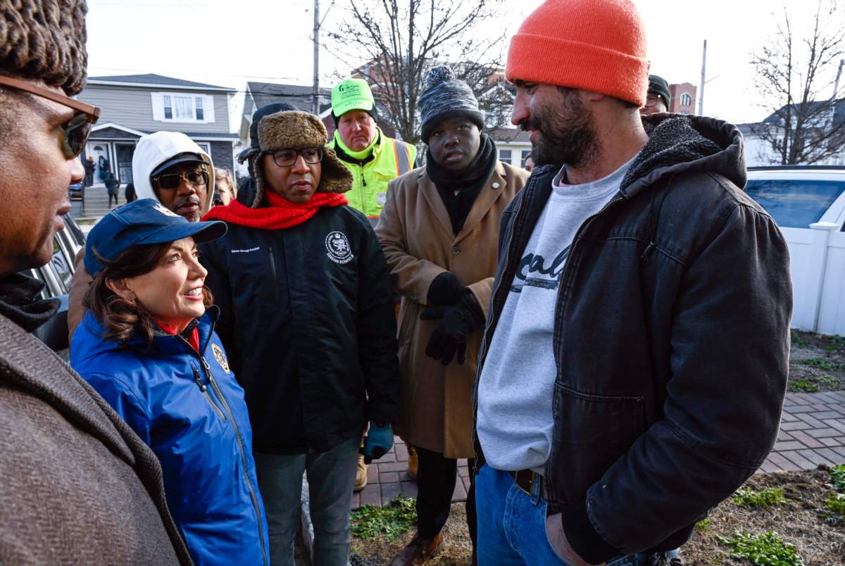 Governor Kathy Hochul speaks with residents affected by Rockaway flooding