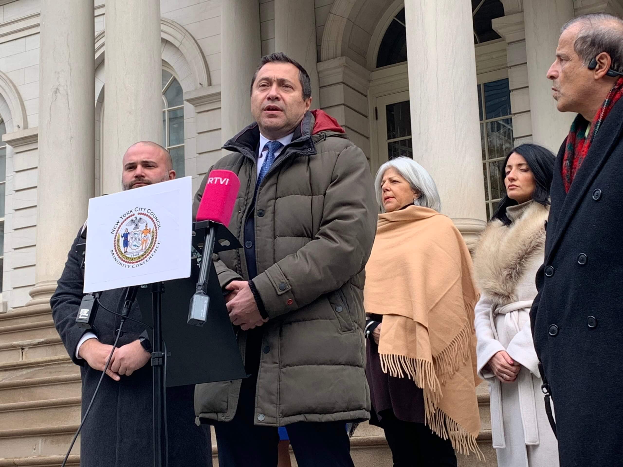 Ari Kagan speaking at City Hall press conference