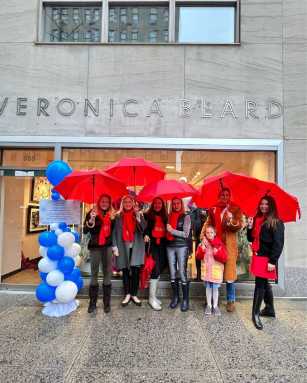 Miracle on Madison Avenue hosts outside of a store