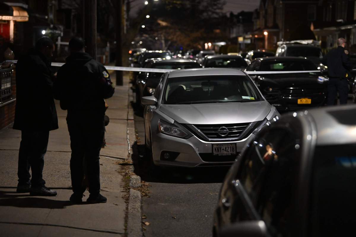 Police investigate a Flatlands block that was the scene of a deadly double shooting Saturday night.