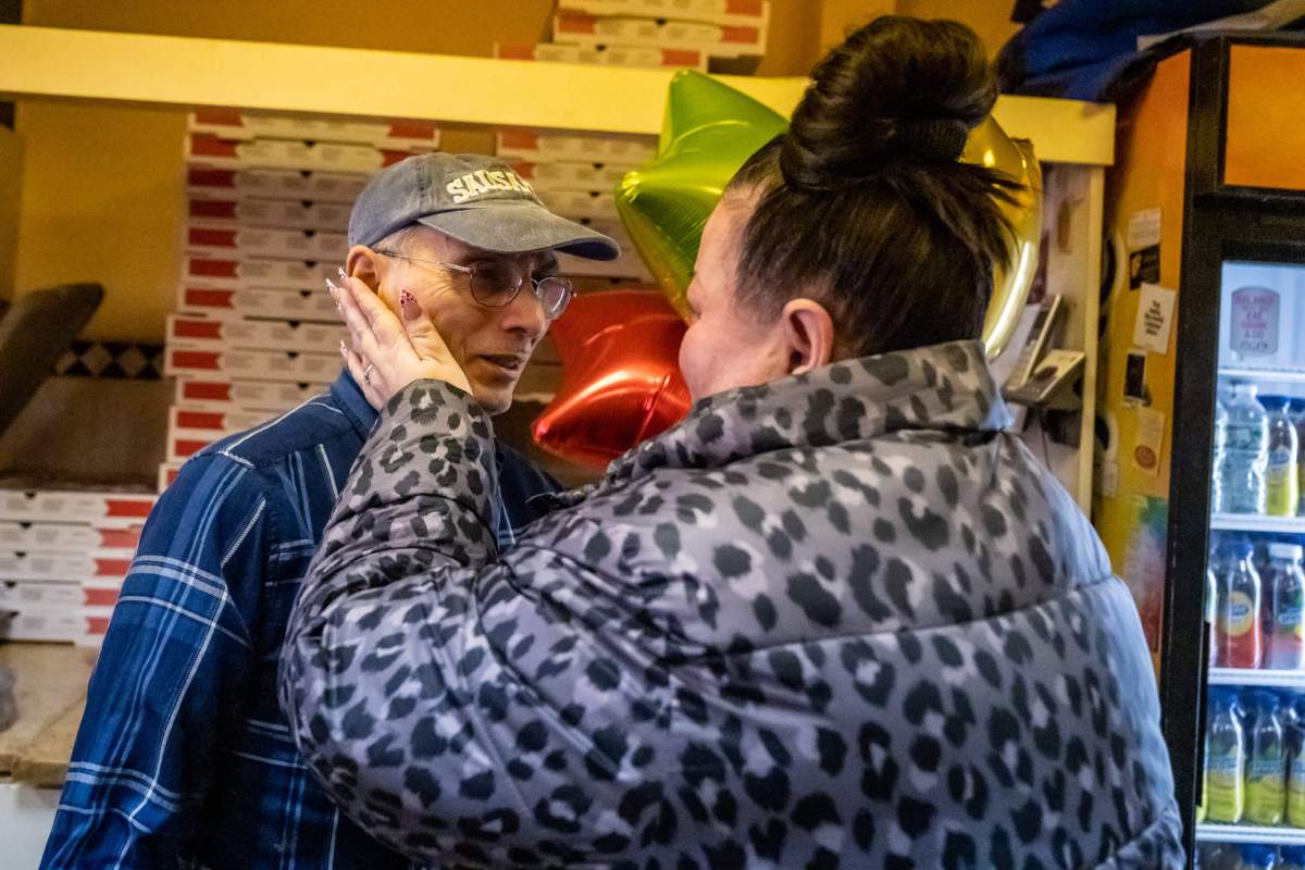 Cathrine Annarumma says goodbye to Frank Giordano before Lenny's Pizza closes for good