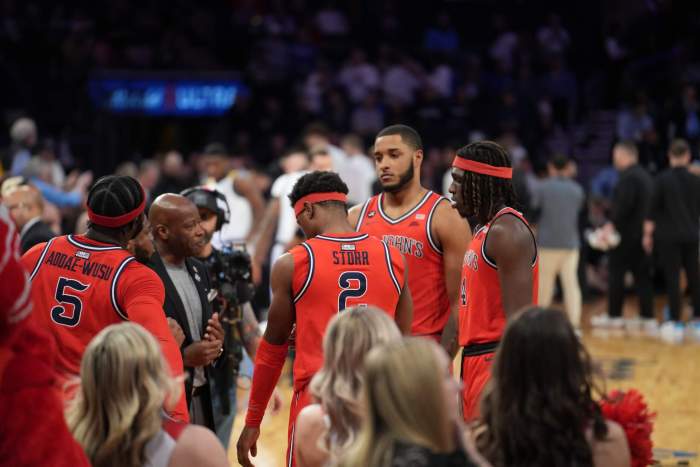 Joel Soriano overlooks the St. John's huddle