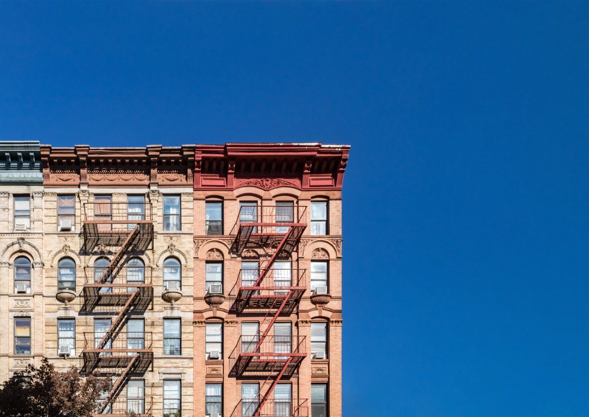 Blue sky above old building in NYC