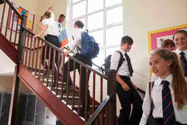 Students walking down staircase at Charter school