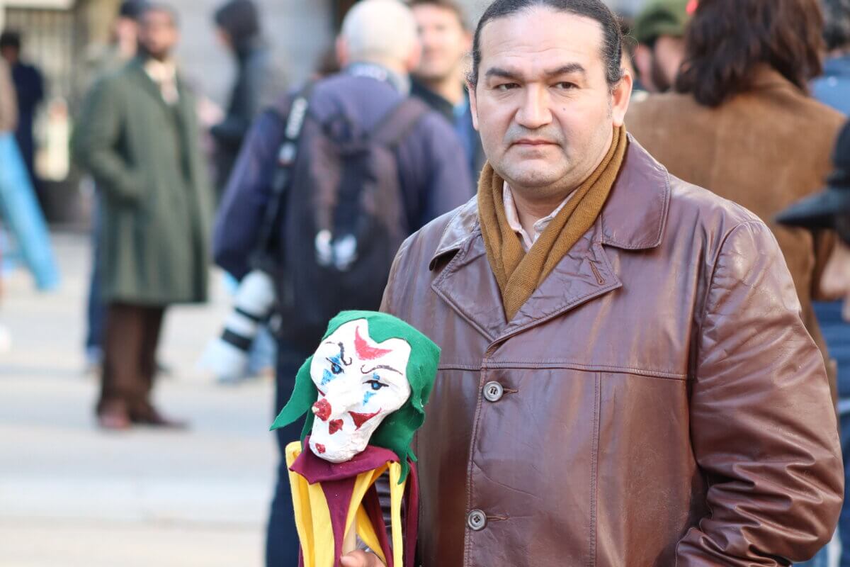 An extra holding a joker puppet on the set of Joker 2, "Joker: Folie à Deux" (Photo by Michael Dorgan)