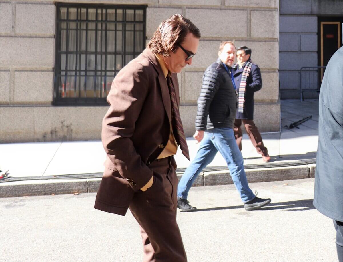 Joaquin Phoenix, who plays Joker, walks to the set of Joker 2, "Joker: Folie à Deux." Phoenix cut an engrossed figure (Photo by Michael Dorgan)
