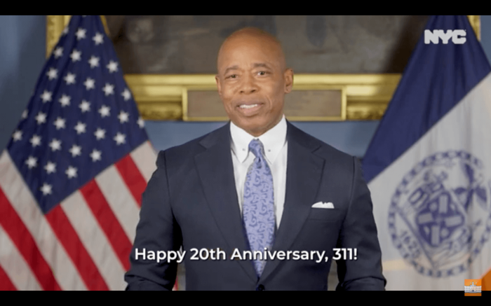 A screenshot of Mayor Eric Adams in a video he recorded to accompany a report his office released on the 20th Anniversary of the 311 service