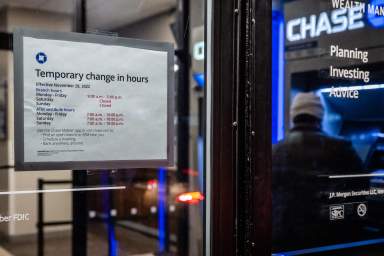 Customer uses ATM at bank in Brooklyn