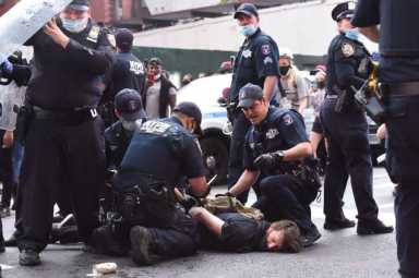 Members of the NYPD's Strategic Response Group arrest