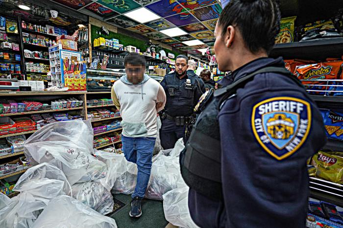 New York City Sheriff's officers searching