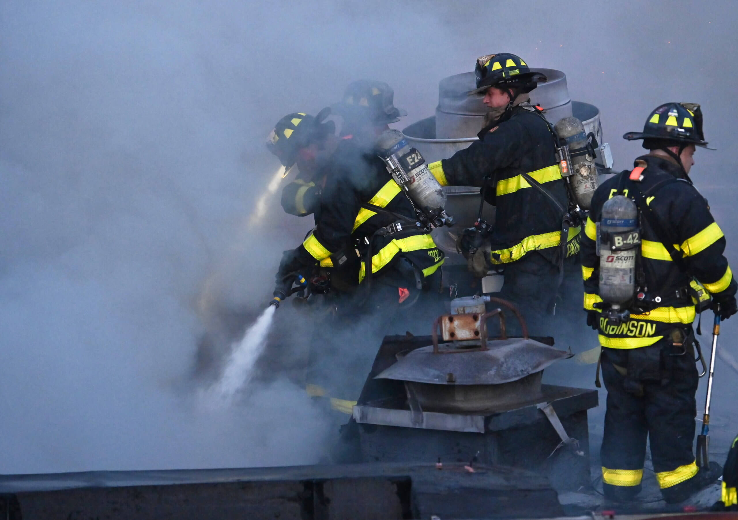 Firefighters operate a hose-line during a four alarm fire at 5802 Utrecht Avenue