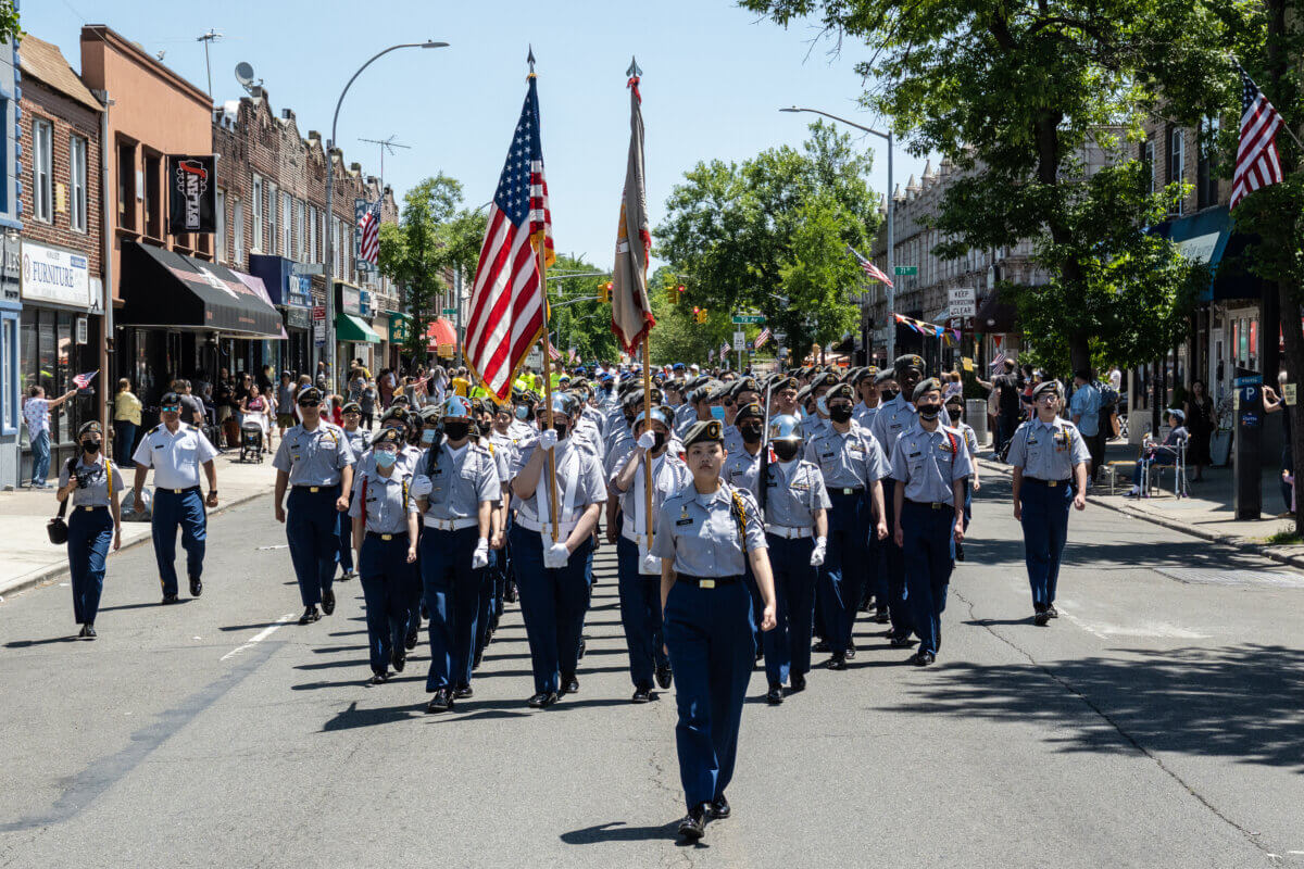 U.S. service members march in the Forest Hills Memorial Day parade