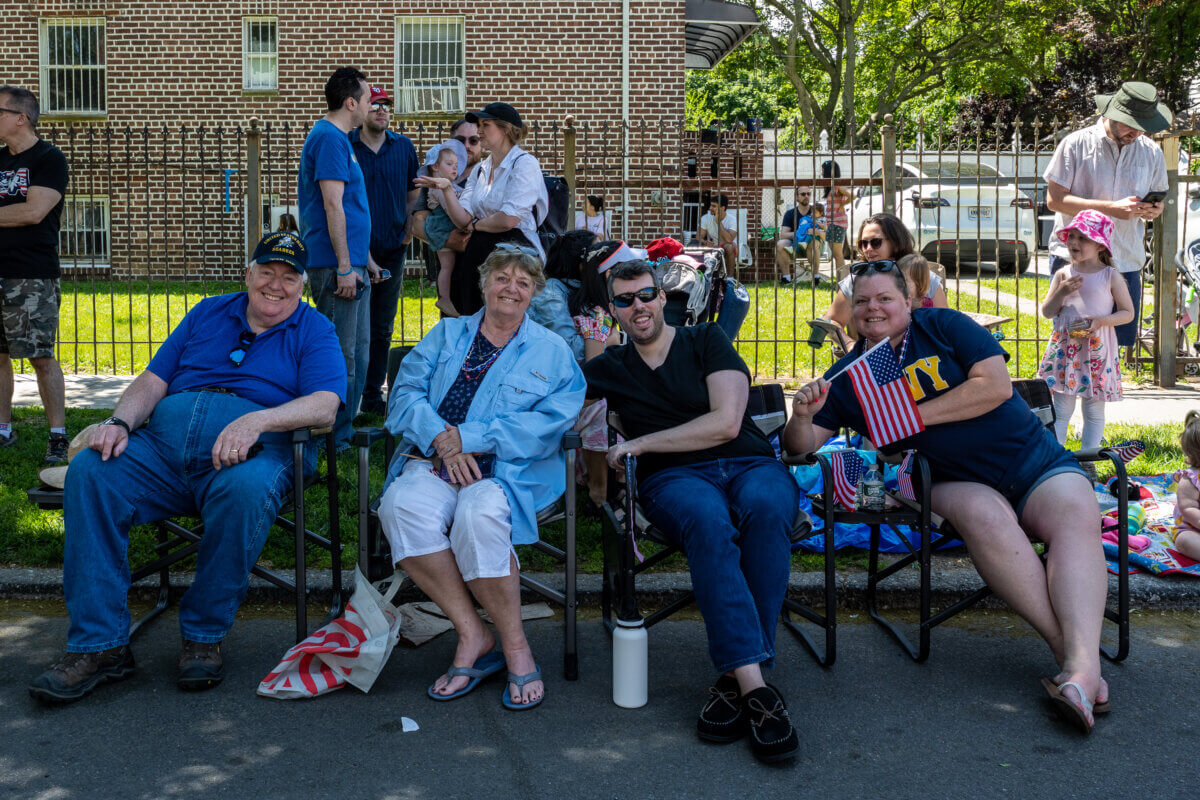 Parade revelers line Metropolitan Avenue in Forest Hills for the Memorial Day parade