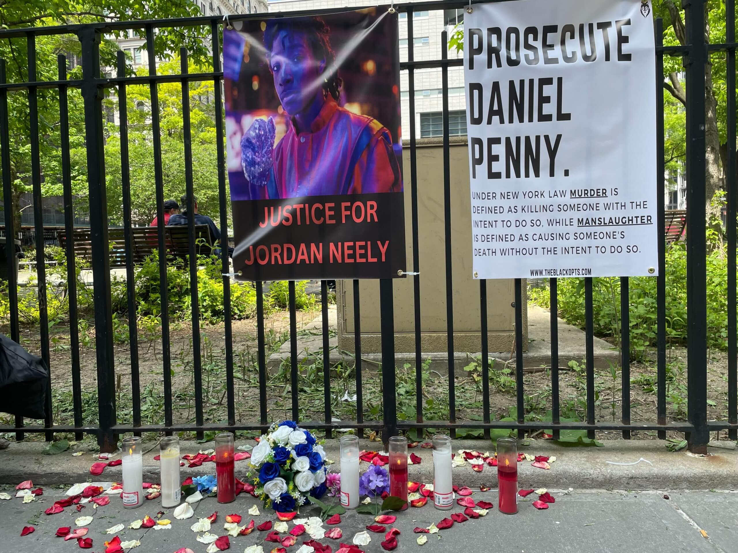 Neely family lawyers say Penny's manslaughter charge isn't enough, call for murder charge in chokehold killing 9 Signs calling for justice for Jordan Neely and charges against Daniel Penny across the street from Manhattan Criminal Court where Penny was arraigned