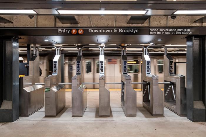 Turnstiles at the downtown platform of the 23rd Street F/M subway stop