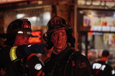 Firefighter covered in soot