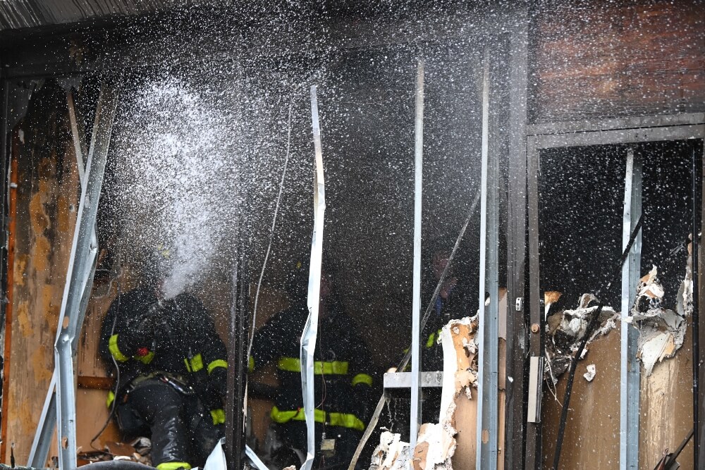 E-bikes, Lithium-ion batteries removed from burning Brooklyn building 3 Firefighters wash down a commercial building property fire at 1553 Nostrand Ave