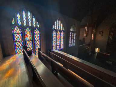 Sunlight Pouring Through a Church’s Stained Glass Windows
