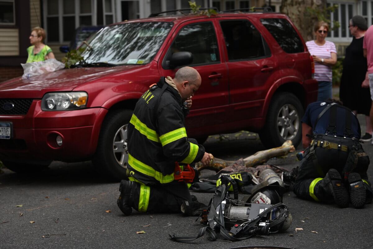 Four people critical, including three children, after early morning Brooklyn blaze 3 Firefighters work at the scene