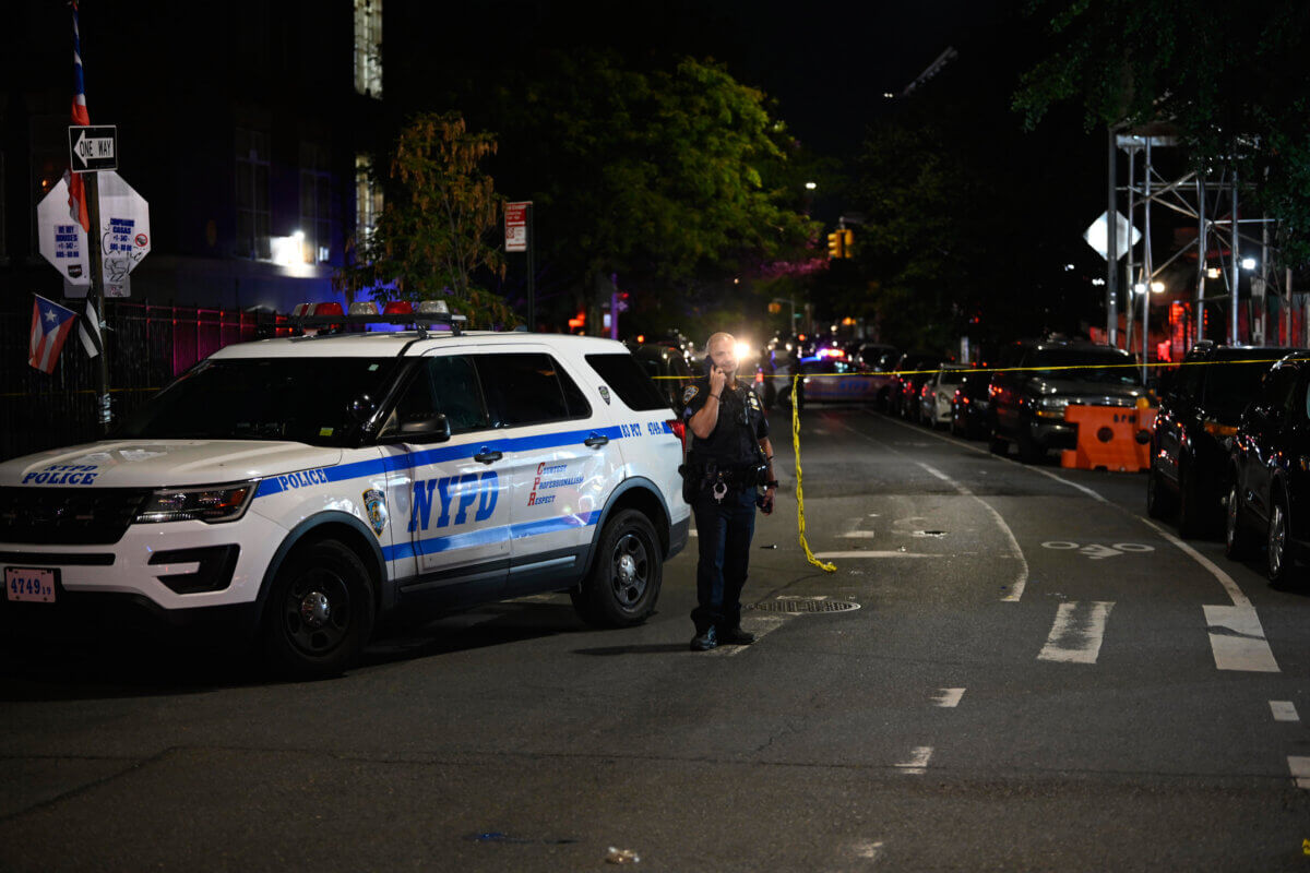 Officers canvass the scene in Bushwick