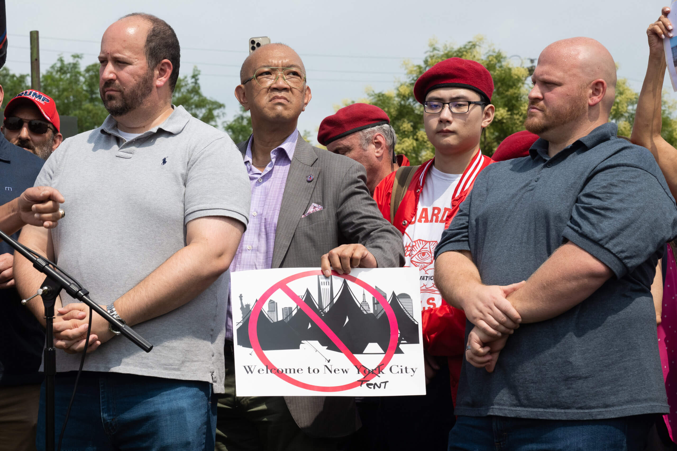 Staten Islanders attend a rally protesting the opening of a migrant center in Midlland