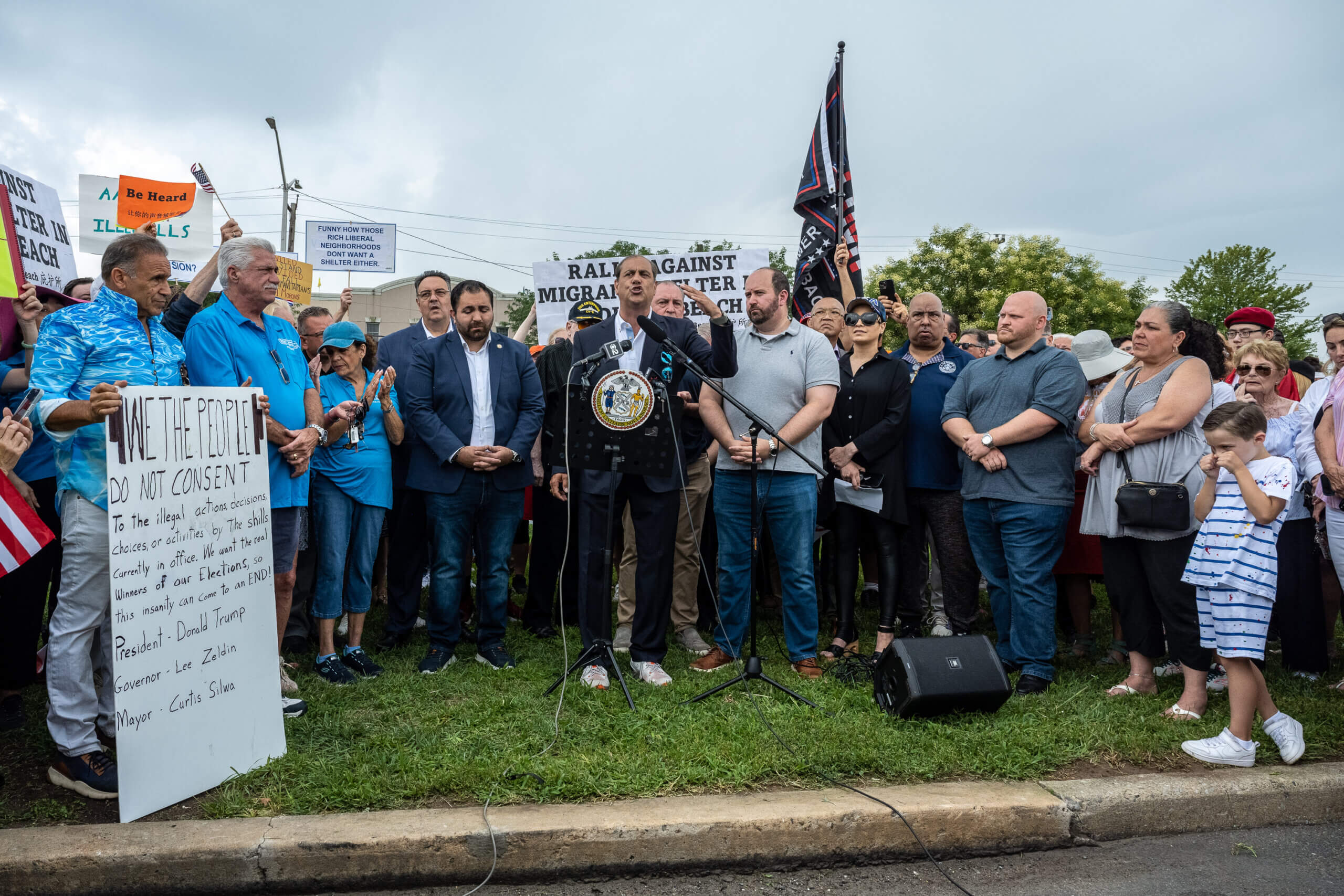 State Senator Andrew Lanza speaks at a rally against the opening of a migrant center