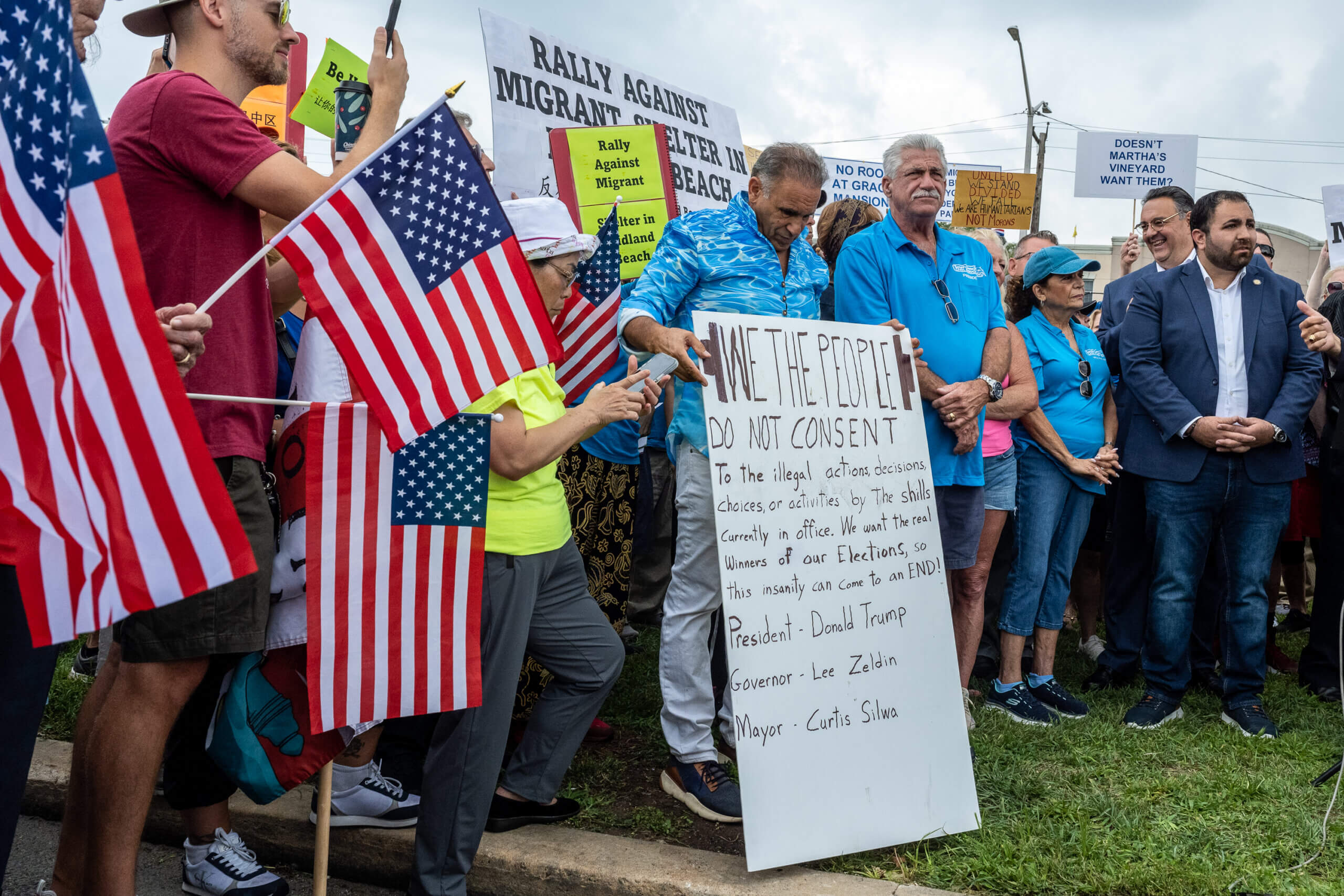 Staten Islanders attend a rally protesting the opening of a migrant center