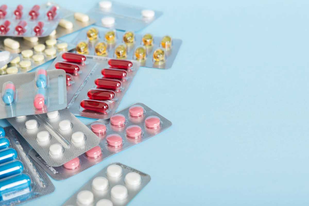 too many different pill of various blisters with different pills Medicines storage at home concept Medication storing. A pile of medicine in blister packs. Pharmaceutical blister packs