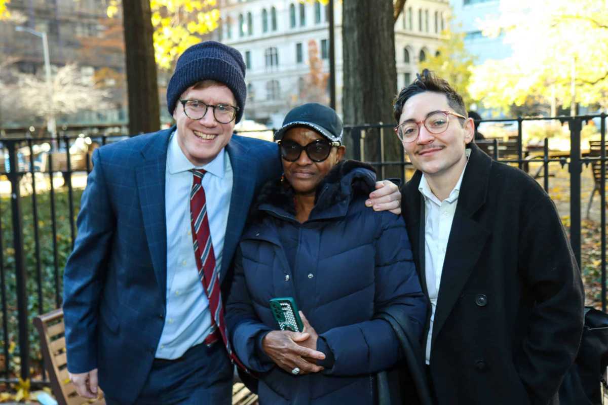 Mother of exonerated Wayne Gardine with Legal Aid Society lawyers following Harlem murder conviction exoneration.