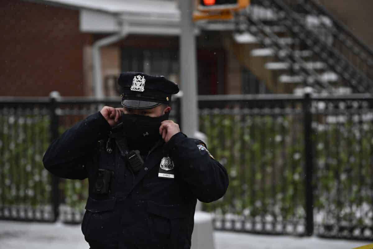 Two officers were shot while responding to an incident at a Brooklyn apartment building