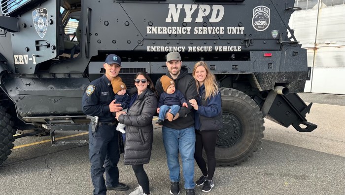 Photo of slain officer Jonathan Diller with family in front of NYPD vehicle