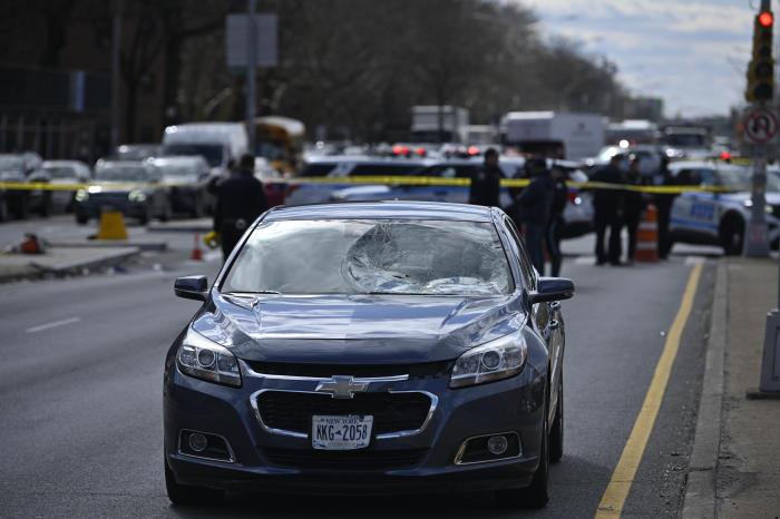 Police and car at scene of deadly Brooklyn collision involving pedestrian