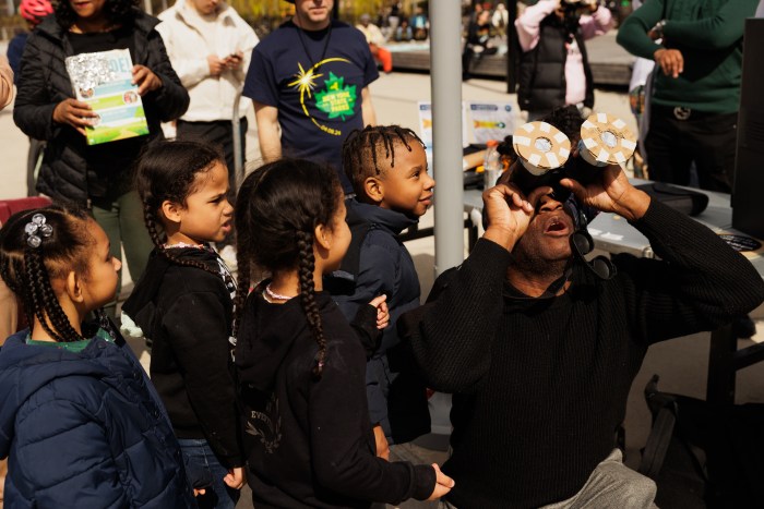 Seeing clearly: NYC hospitals report no increase in eye problems related to eclipse 4 People gather in Roberto Clemente State Park