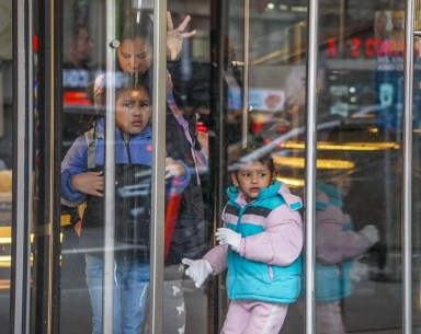 Migrants looking out window